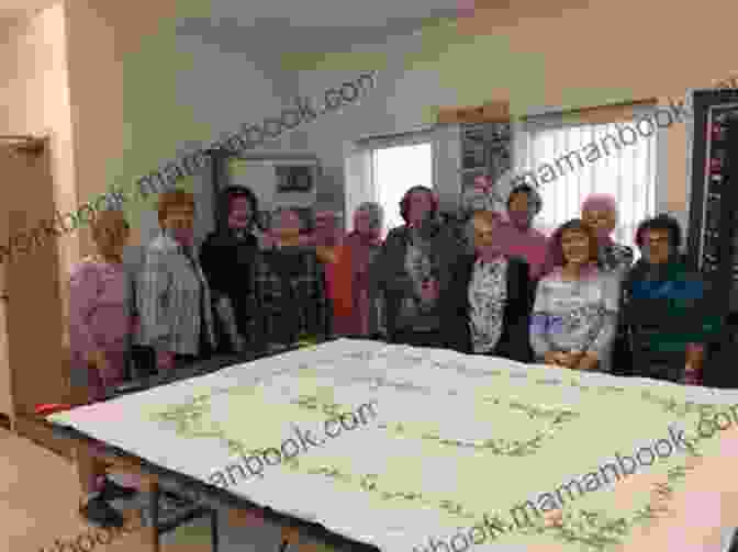 A Group Of Quilters Gathered Around A Large Quilt In A Meeting Room Secrets Of A Successful Quilt Club: A Ministry Model